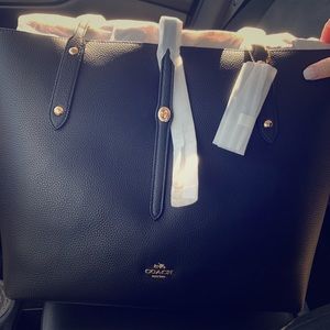 Brand new black coach purse. Never used.